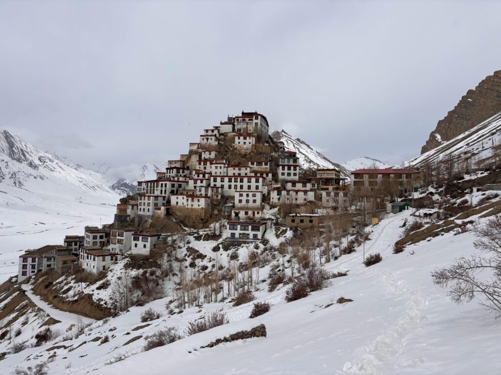 A picturesque monastery nestled in the snowy mountains of Spiti Valley, Himachal Pradesh.